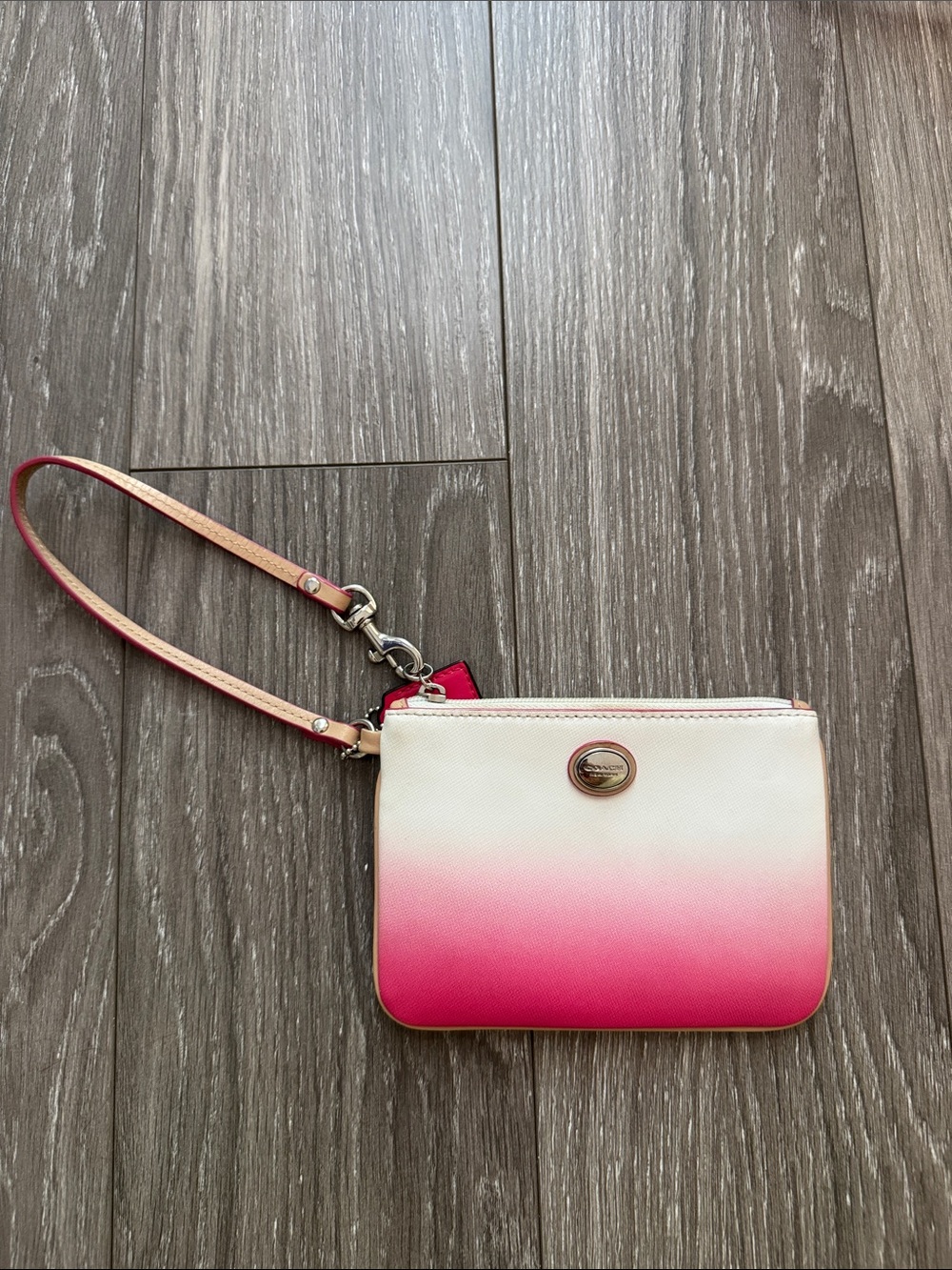Pink and white coach wristlet